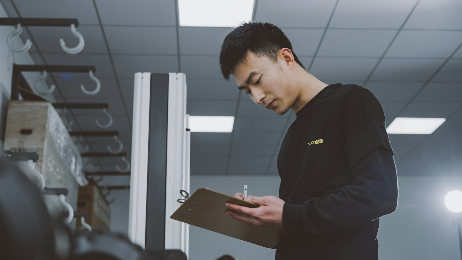 Inspector reviewing a compliance checklist on a clipboard